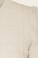 The Ice Skater Cardigan in Antique White Mélange, Stoffdetail