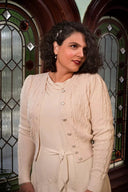 The Ice Skater Cardigan in Antique White Mélange, am Model