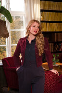 The Ice Skater Cardigan in Black Cherry, am Model